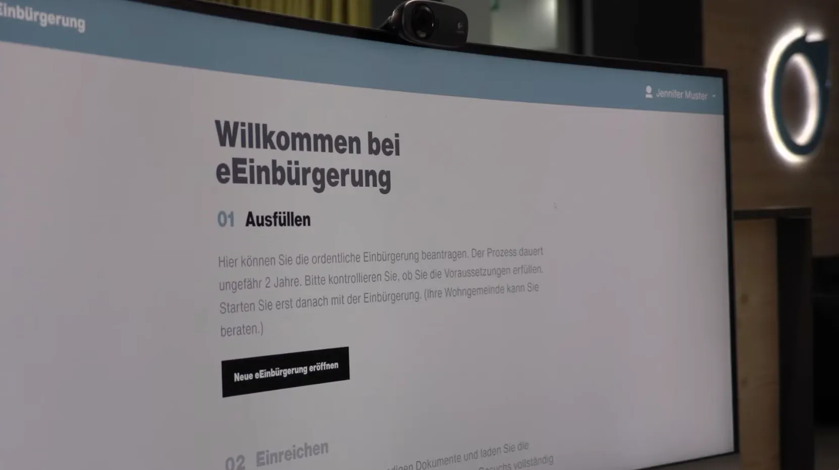 Der Startbildschirm der eEinbürgerung auf einem Monitor im Büro von xappido